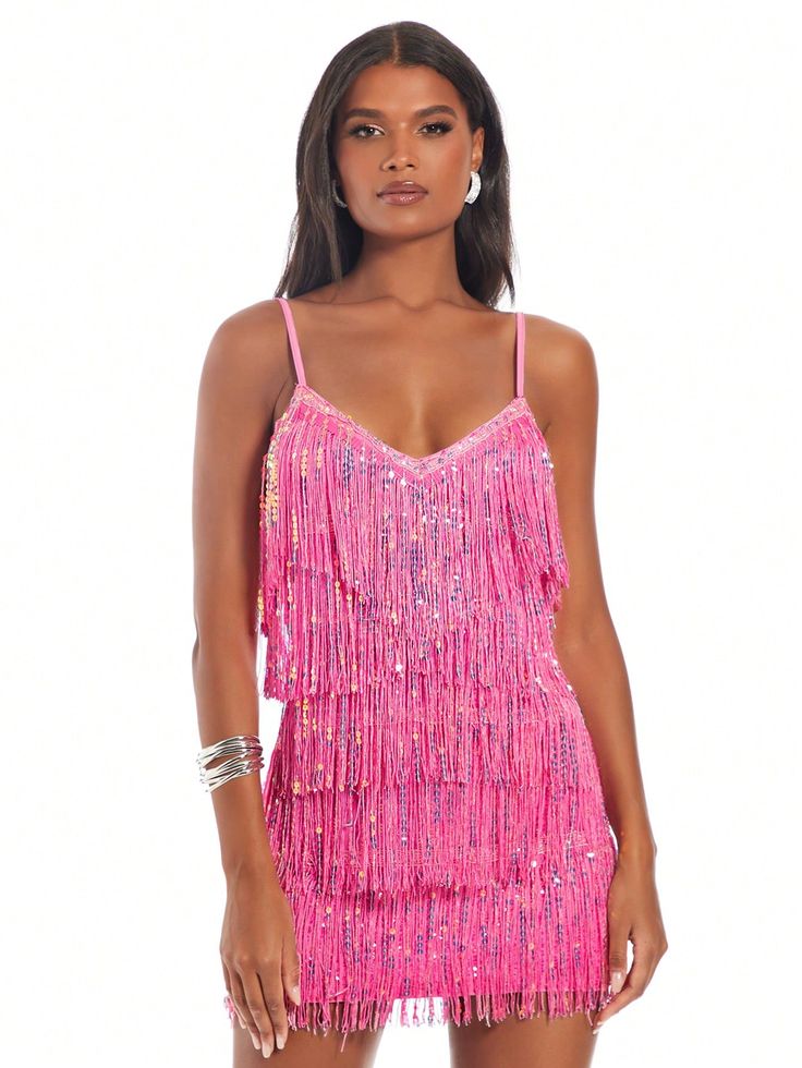 a woman wearing a pink fringe dress