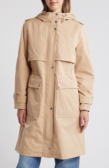 Classic trench detailing—including belted cuffs and gun flaps—brings a timeless look to this longline jacket topped with an adjustable hood. 39" length (size Medium) Front zip closure with snap storm placket Drawcord-toggle hood Belted cuffs Front snap-flap patch pockets Epaulets Gun flaps Storm flap Internal drawcord waist 100% polyester Machine wash, tumble dry Imported Winter Outerwear With Flap Pockets In Gabardine, Winter Utility Raincoat With Detachable Hood, Spring Workwear Parka With Adjustable Hood, Winter Utility Outerwear With Storm Flap, Winter Workwear Parka With Flap Pockets, Winter Gabardine Outerwear With Belted Cuffs, Spring Workwear Parka With Flap Pockets, Utility Fall Parka With Storm Flap, Fall Utility Parka With Storm Flap