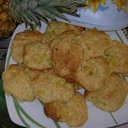 pineapples and biscuits on a plate next to a pineapple