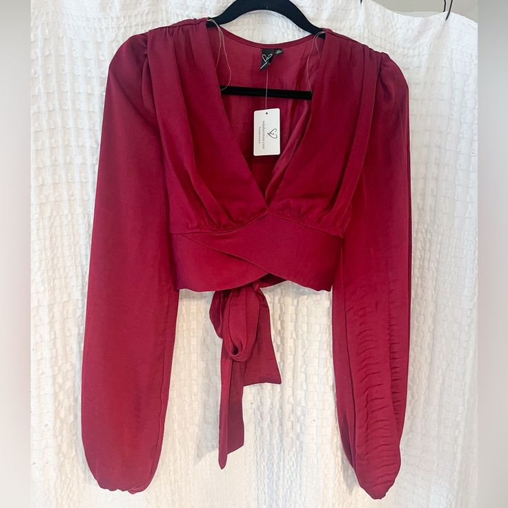 New With Tags Beautiful Red Silk Like Blouse. Long Sleeve, Cute Tie Detail In The Back. Size Xs Red Elegant Cropped Top, Elegant Red Cropped Top, Burgundy Long Sleeve Tops For Night Out, Burgundy Tops For Date Night In Fall, Burgundy V-neck Top For Date Night, Red Blouse For Date Night In Fall, Red Tops For Date Night In Fall, Trendy Red Blouse For Date Night, Blouse Long Sleeve