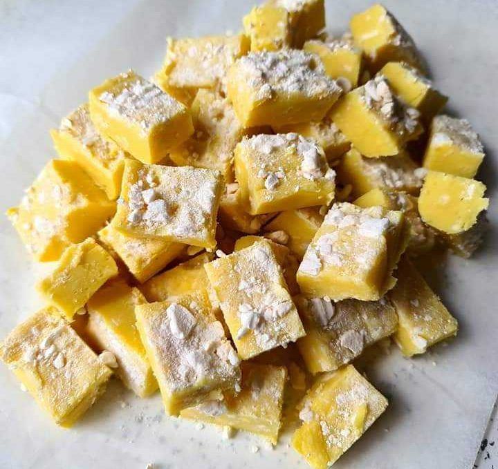 a pile of cubes of food sitting on top of a table