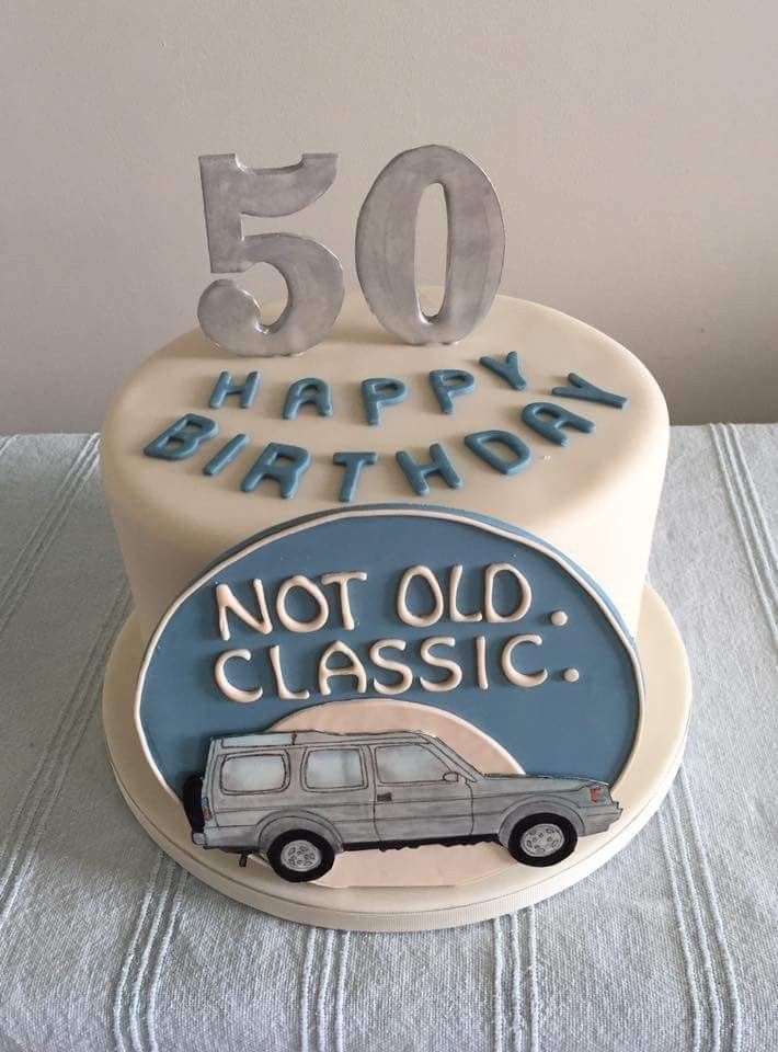 a 50th birthday cake with the number 50 on it and an image of a car