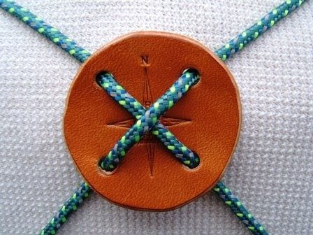 an orange button with blue and green beads on it