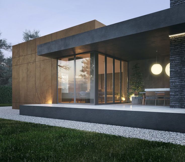 an exterior view of a modern house at dusk