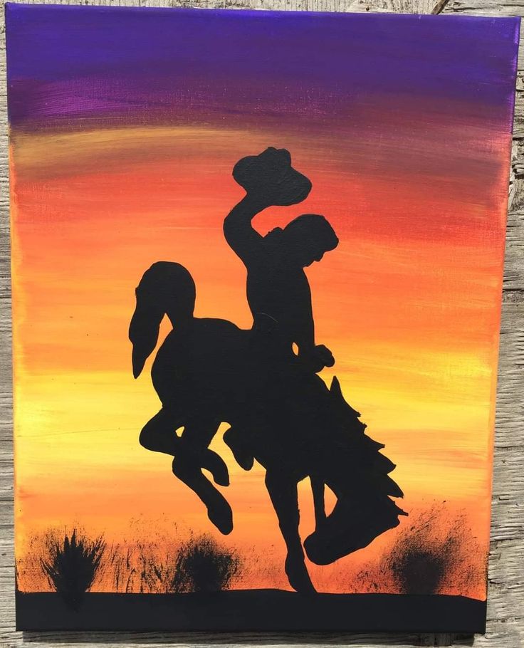 a painting of a cowboy riding a horse with the sun setting in the sky behind it