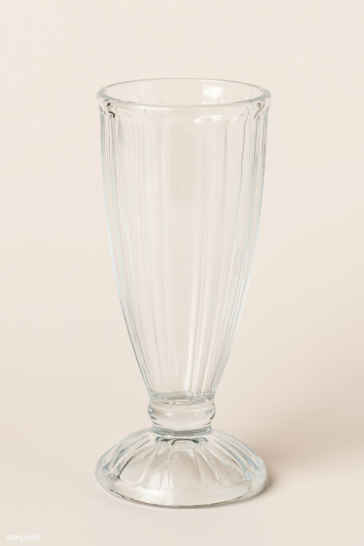 a clear glass vase sitting on top of a table