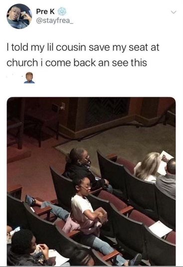 some people are sitting in chairs and one is holding a small child while the other looks on