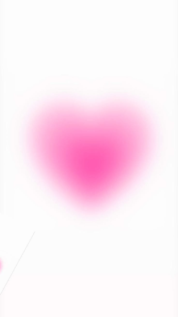 a pink heart shaped object on a white background