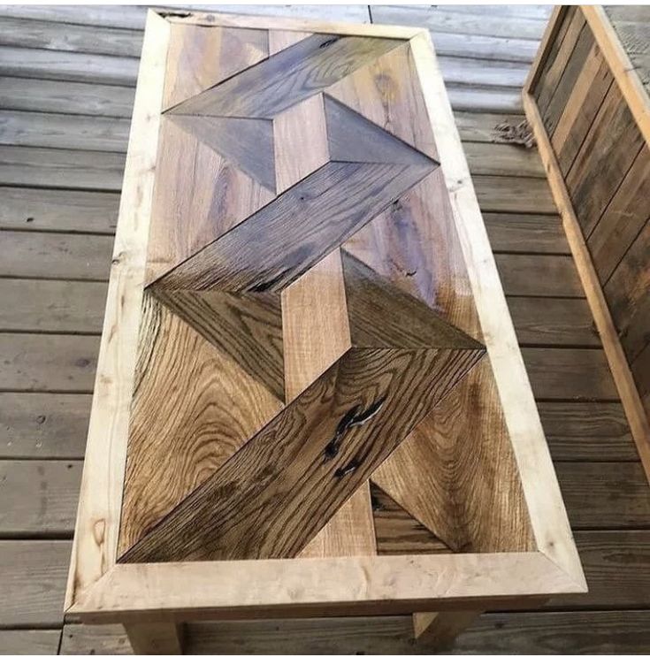 a table made out of wood with an arrow design on it