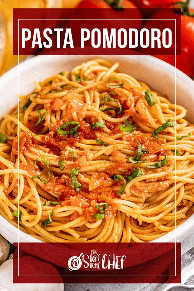 pasta pomodoro in a white bowl with basil on top