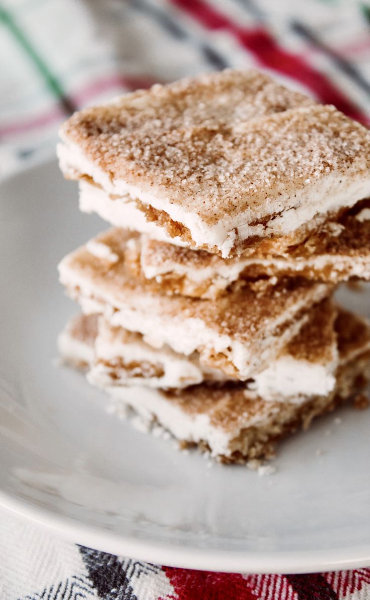 three pieces of dessert sitting on top of a white plate