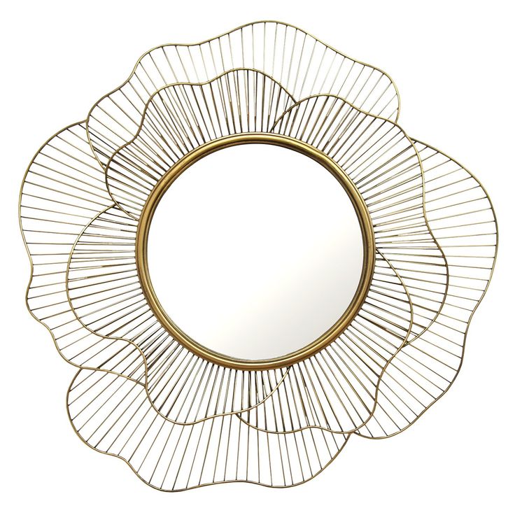 a white and gold flower shaped mirror