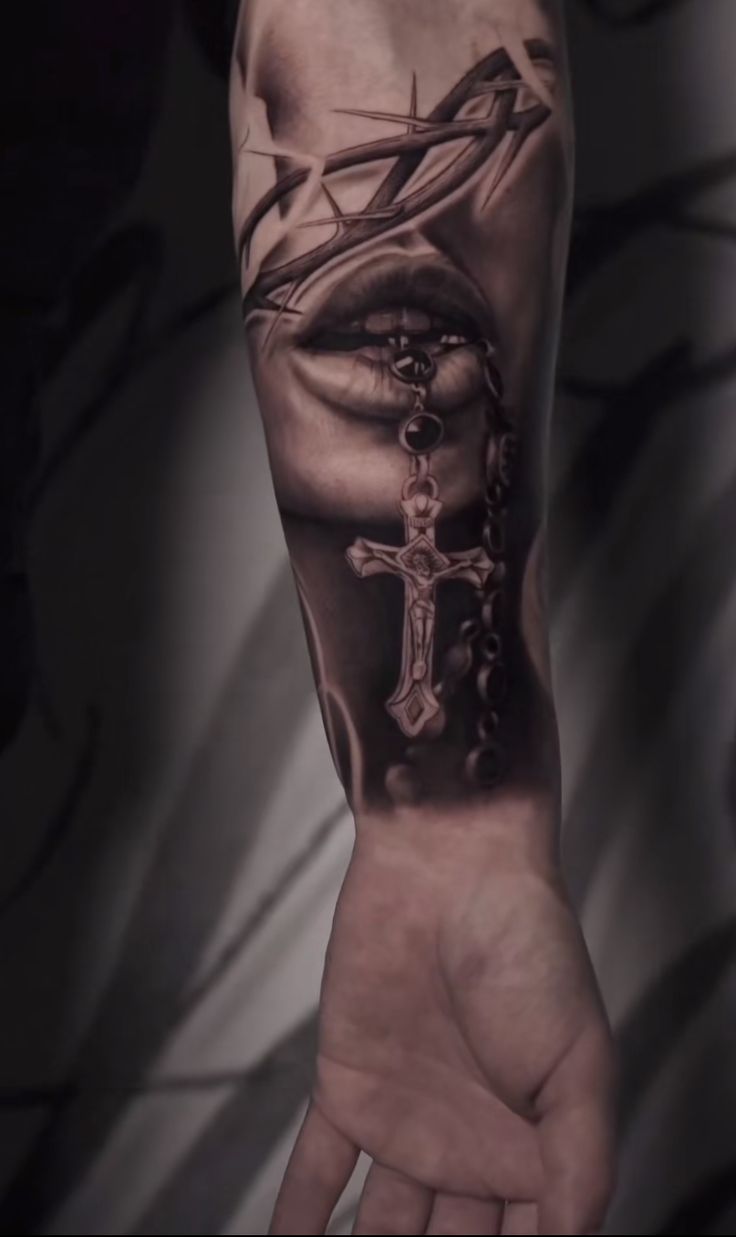 a person with a cross on their arm