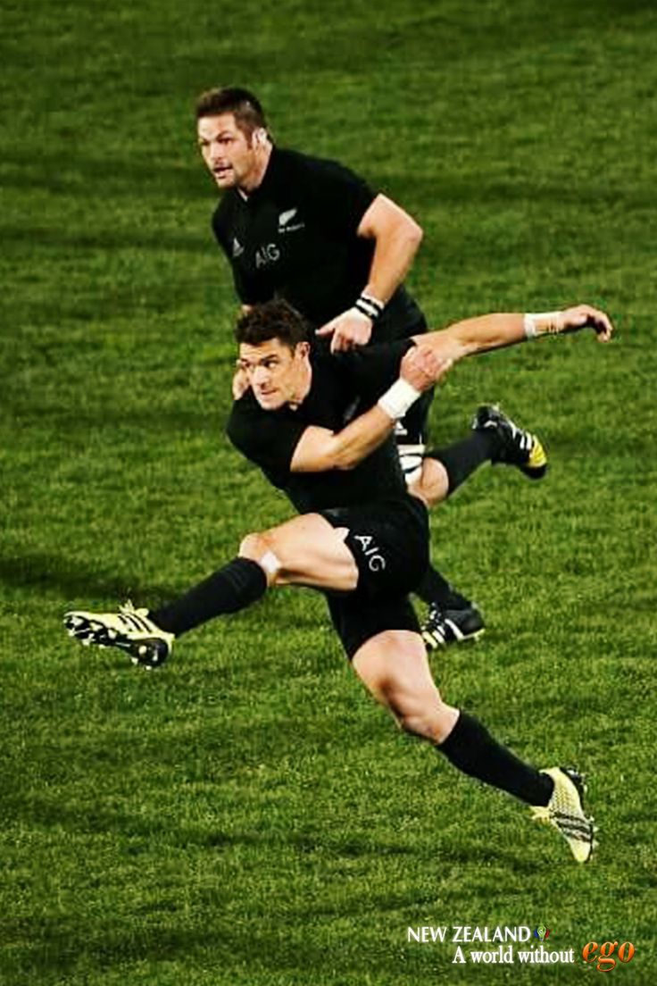 two men are playing soccer on the field