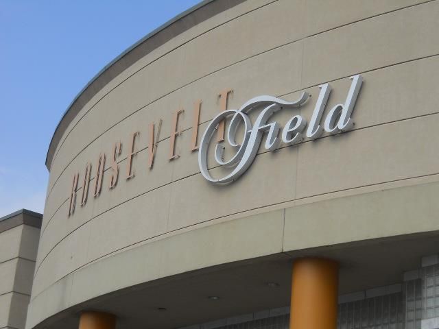 the outside of a building that has a sign on it saying, hubfit field