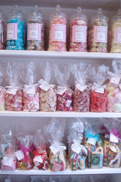 the shelves are filled with candy and candies