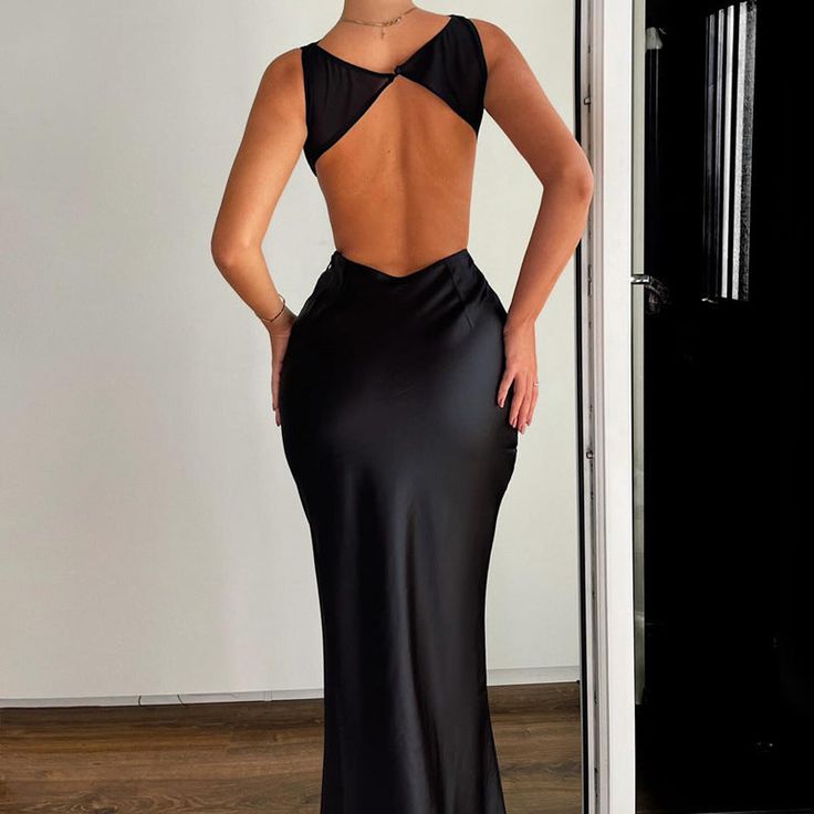 Features: Introducing our Satin Backless Bodycon Maxi Dress, designed for the ultimate in elegance and style. Made with high elastic satin material, this dress boasts a figure-hugging bodycon fit that will turn heads at any club or party. With its O-neck and sleeveless design, this dress is both sexy and versatile. Elevate your wardrobe with this chic and sophisticated piece. Fitted Backless Evening Dress With Built-in Bra, Fitted Backless Dress With Built-in Bra For Club, Elegant Fitted Backless Dress With Built-in Bra, Fitted Satin Backless Dress, Sleek Bodycon Backless Dress, Evening Backless Dress With Built-in Bra, Fitted Satin Backless Dress For Club, Bodycon Backless Dress With Built-in Bra, Club Dress With Backless Design And Built-in Bra