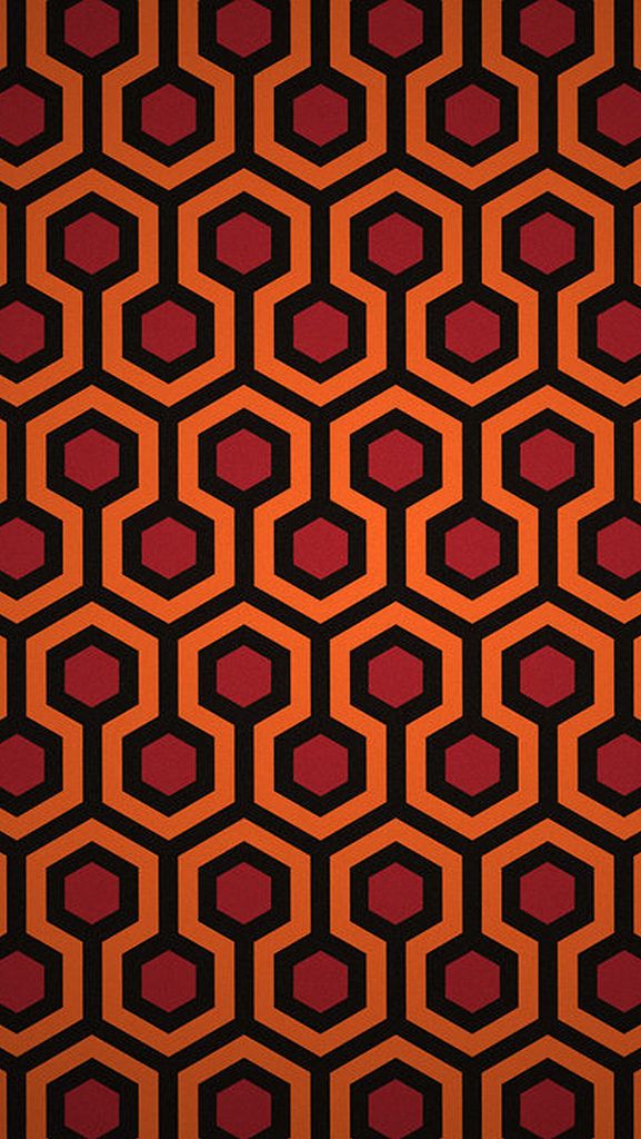 an orange and black pattern with hexagonal shapes