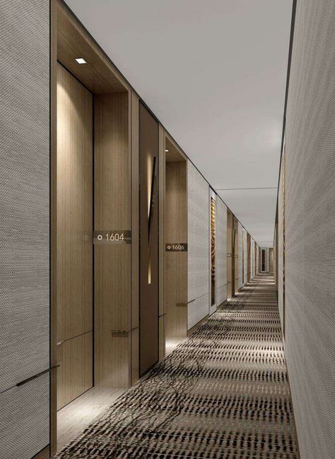 the hallway is lined with wooden doors and checkered carpeted flooring on both sides