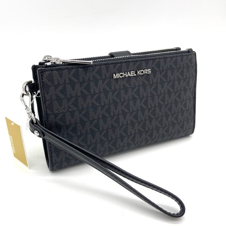 Brand New With Tag Michael Kors Large Double Zip Wallet Wristlet Color: Black Silver Tone Hardware Outlet Style Michael Kors, The Signature Logo Jet Set Double Zip Wristlet Features: Zip Closure Interior: 2 Top Zip Pockets Exterior: 6 Credit Card Pockets, 1 Window Pocket, 1 Phone Pocket, 3 Slip Pockets Fits Up To Iphone 7+ - 8+ Approx. 7.25" W X 4" H X 1.5" D Black Michael Kors Wallet, Black Clutch Wallet With Wrist Strap, Black Wallets With Wrist Strap For Evening, Black Evening Wallet With Wrist Strap, Michael Kors Black Wallet For Everyday Use, Michael Kors Black Everyday Wallets, Black Clutch With Silver-tone Hardware For Everyday Use, Logo Jet, Micheal Kors Wallet