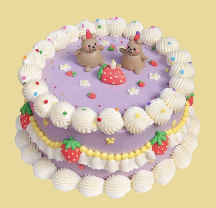 there is a cake that has two bears on the top and one strawberry on the bottom