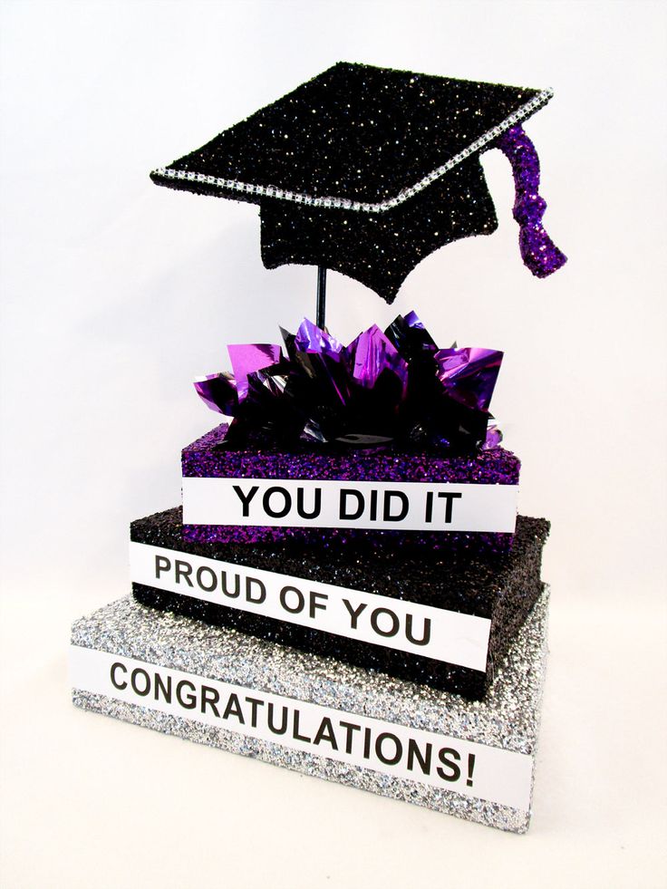 a graduation cap on top of two books with congratulations written on it and the words you did it proud of you