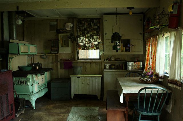 an old fashioned kitchen and dining room are seen in this image