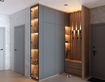 an empty room with some lights on the wall and two doors open to reveal closets