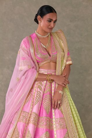 Barfi pink lehenga with separate cancan skirt, embellished with Kashmiri patti motifs in dori, sitara kaam and embellished with haathphool and sonchidiya border edged with jhallar lace work. Paired with V neck embroidered padded blouse. Comes with mint wallflower print dupatta and an pink organza dupatta adorned with embroidered borders and jhallar lace work. - Aza Fashions Pink Ceremonial Sets For Diwali, Pink Fitted Ceremonial Traditional Wear, Ceremonial Pink Fitted Traditional Wear, Ceremonial Fitted Pink Traditional Wear, Ceremonial Pink Sets With Zari Work, Ceremonial Pink Traditional Wear With Zari Work, Ceremonial Pink Traditional Wear With Resham Embroidery, Pink Resham Embroidery Traditional Wear For Ceremonial, Pink Ceremonial Set For Navratri