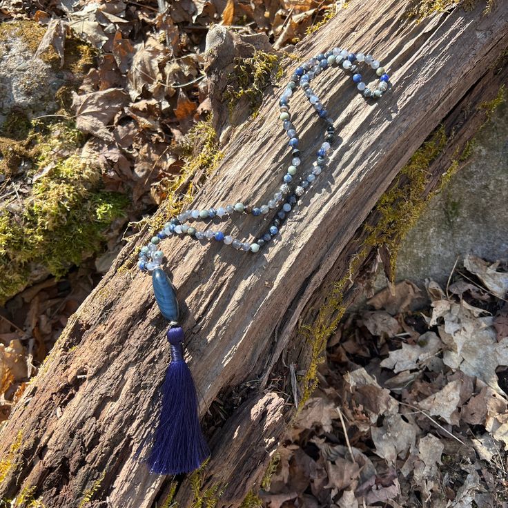 The Self Awareness Intention Necklace is made with Iolite, Eagle Eye, Sodalite, and Sardonyx stones along with a Blue Tigers Eye main focal stone. The unique combination of these powerful stones brings a sense of deep strength from within that allows you to trust your intuition and voice, along with a feeling of optimism and hope. Materials include: 6mm Iolite, Eagle Eye, Sodalite, and Sardonyx beads 42mm (1.75") Blue Tigers Eye focal stone 3.5" luxe, silky, deep blue tassel indigo colored C-Lon thread Necklace Length: 30" to main stone; 34.5" total. Necklace Length Guide Blue Tigers Eye is a symbol of strength. It calls on courage, deepens willpower, and helps those who wear it to overcome all kinds of challenges in their lives. Iolite has been used by shamans to enhance their ability to Sardonyx Stone, Trust Your Intuition, Necklace Length Guide, Thread Necklace, Symbols Of Strength, Blue Tigers, Indigo Colour, Eagle Eye, Blue Tassel