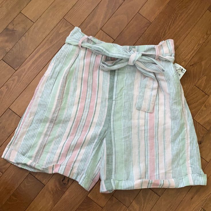 A Lovely Spring/Summer Staple! Pleated, Belted And Finished With A Crisply Folded Hem, These Light And Easy Linen-Blend Striped Shorts Are A Future Go-To For Sunny Adventures. Zip Fly With Hook-And-Bar Closure Removable Tie Belt Front Slant Pockets; Back Welt Pockets Folded Hem 55% Linen, 45% Rayon Machine Wash, Tumble Dry Chic Striped Spring Shorts, Chic Striped Shorts For Spring, Green Cotton Bottoms For Summer Outings, Summer Cotton Bottoms With Tie Waist, Spring Vacation Shorts With Tie Waist, Striped High Waist Shorts For Summer, High Waisted Striped Shorts For Summer, High Waist Striped Shorts For Summer, Casual Tie Waist Shorts For Spring