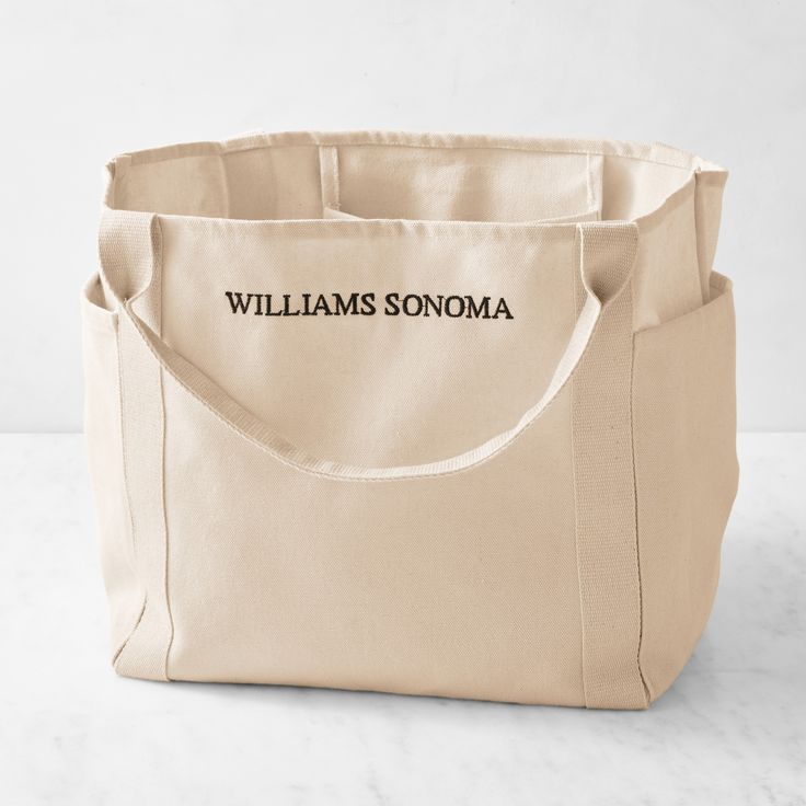 a canvas tote bag with the words williams sonoma printed on it, sitting on a marble surface