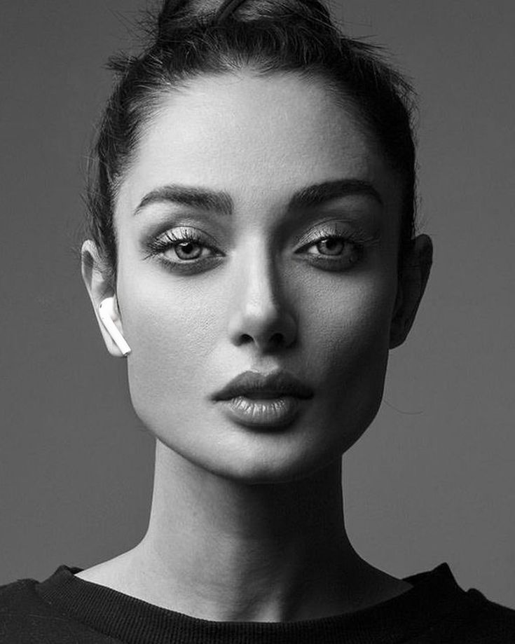 a black and white photo of a woman's face