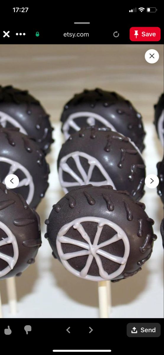 chocolate covered desserts with white wheels on sticks in front of an instagramr