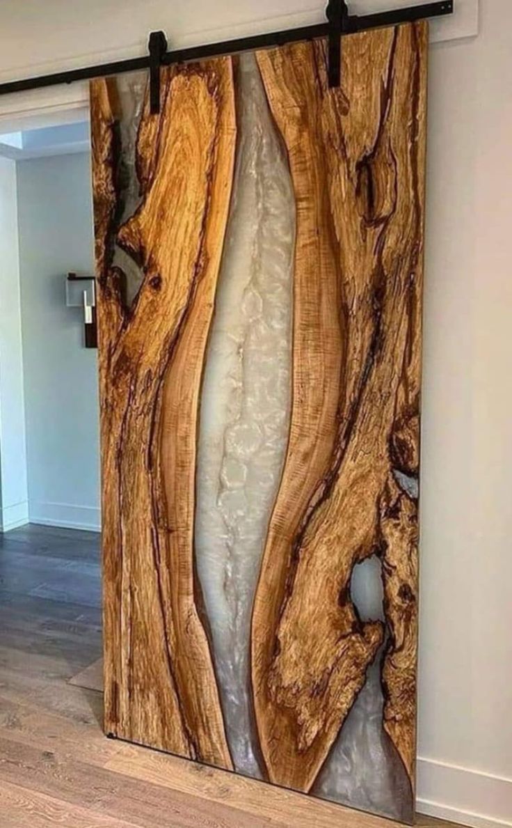 an image of a wooden wall in the middle of a room with wood flooring