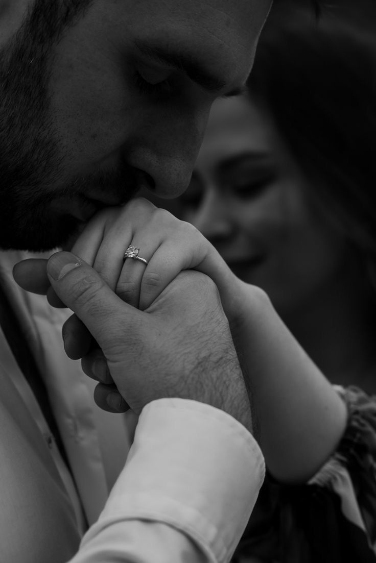 a man and woman are holding hands together