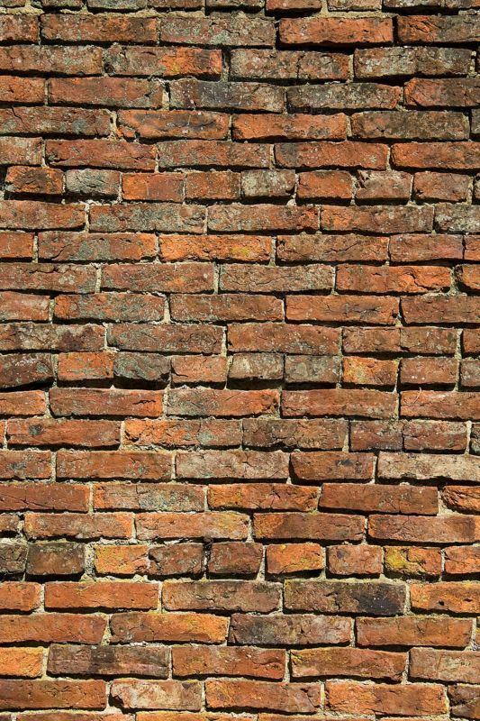 an old brick wall is shown in this image