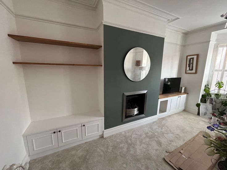 a living room filled with furniture and a fire place in the middle of the room