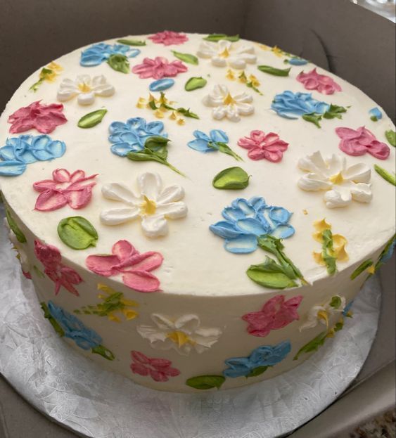 a white cake with colorful flowers on it