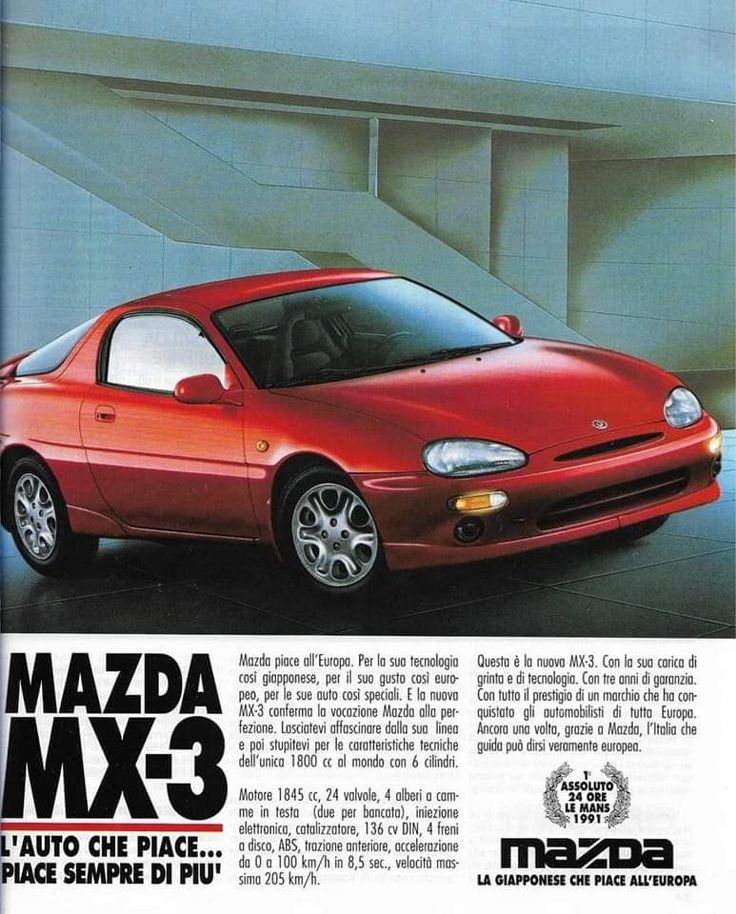 an advertisement for the mazda max - 3 coupe car, with its front end painted red