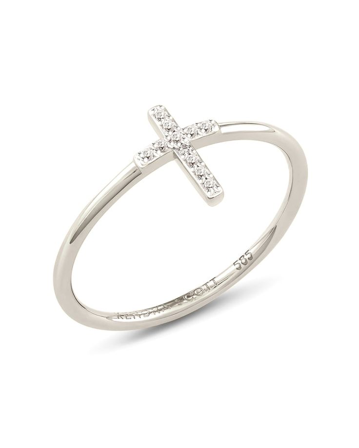 Make one of the world's most meaningful symbols a permanent addition to your accessories and a constant reminder of what matters most to you with the Cross 14k White Gold Band Ring in White Diamond. 

 We have taken steps to ensure that, when applicable, our diamonds are conflict free by requiring our suppliers to comply with the Kimberley Process. Symbolic White Gold Diamond Ring Gift, Symbolic White Gold Diamond Ring As A Gift, Elegant Cross Rings With Diamond Accents, Classic White Gold Diamond Ring Si Clarity, Silver 14k Gold Diamond Ring With Si Clarity, Symbolic White Gold Diamond Ring, Anniversary White Gold Cross Rings, Elegant Diamond Cross Ring, Fine Jewelry White Gold Rings With Si Clarity