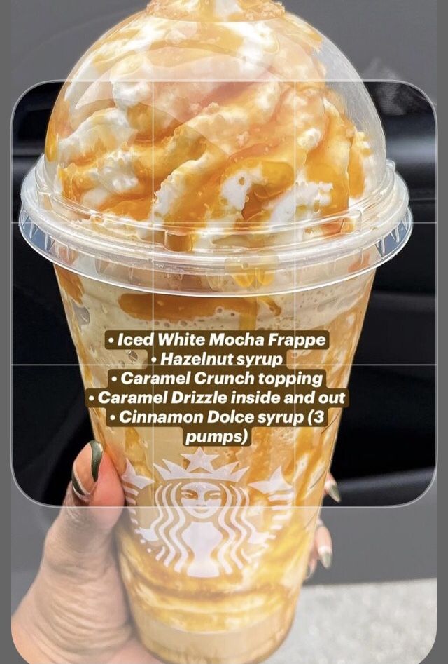 a person holding up a cup filled with ice cream and caramel drizzle