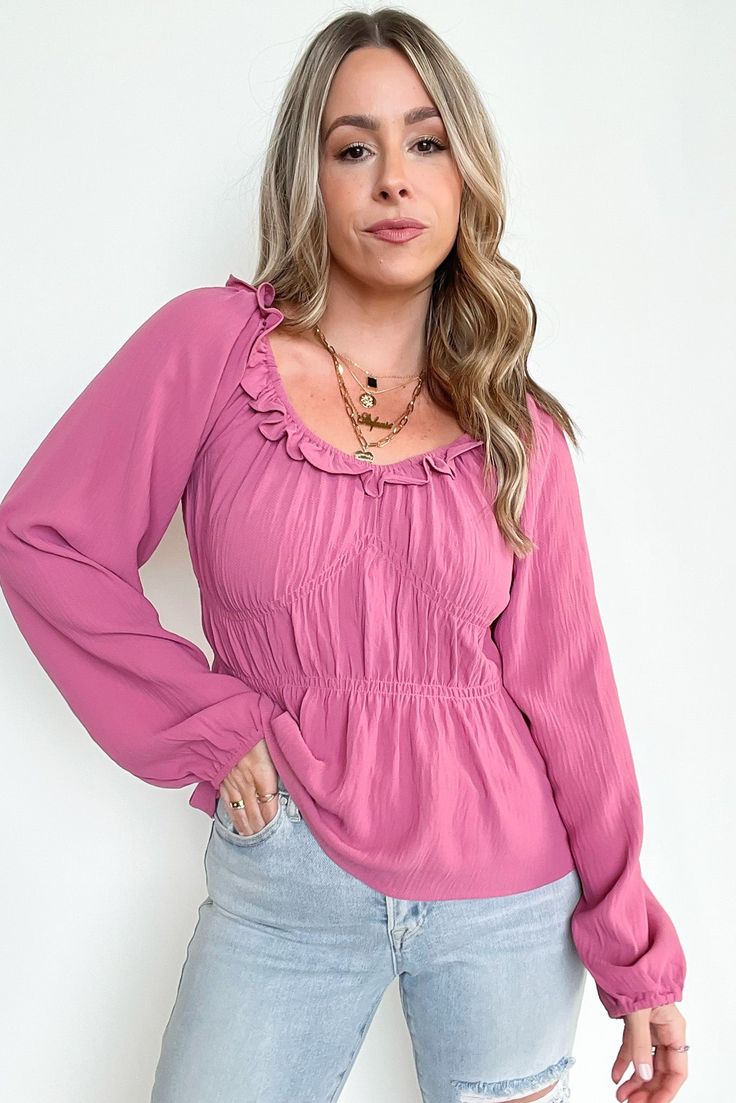 Details: Ruffle detail ruched top - Ruffle detail- Long sleeves Content: 50% RAYON 28% POLYESTER 22% NYLON Size + Fit: Model is 5'4" and wearing a Small - Measurements from a size small - Full length: 17.5" - Chest: 24" - Waist: 24" - Sleeves: 26" Brand: 143 Story Chic Tops With Gathered Neckline For Day Out, Spring Tops With Gathered Neckline For Day Out, Spring Ruched Long Sleeve Blouse, Spring Ruched Blouse, Spring Long Sleeve Tops With Ruffle Hem, Spring Long Sleeve Ruched Blouse, Casual Long Sleeve Smocked Top With Ruffle Hem, Casual Tops With Gathered Neckline For Spring, Feminine Flowy Top With Ruffle Hem