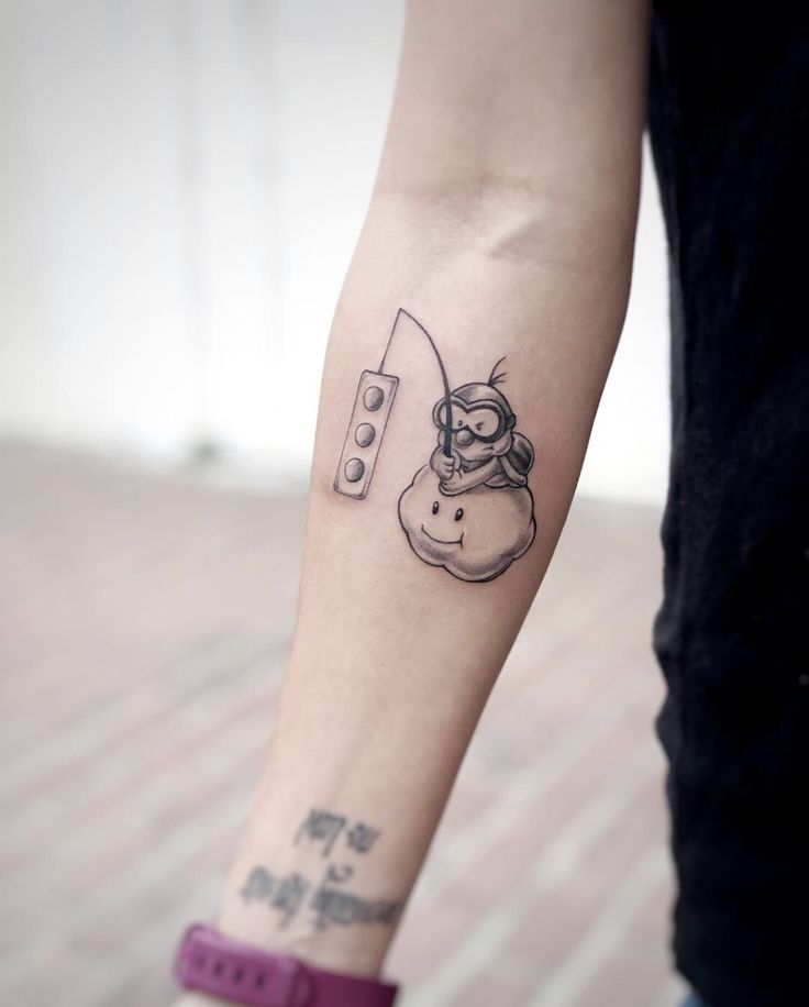 a person with a small tattoo on their arm