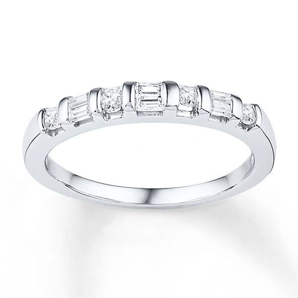 a white gold wedding band with baguetts on the side and diamonds in the middle