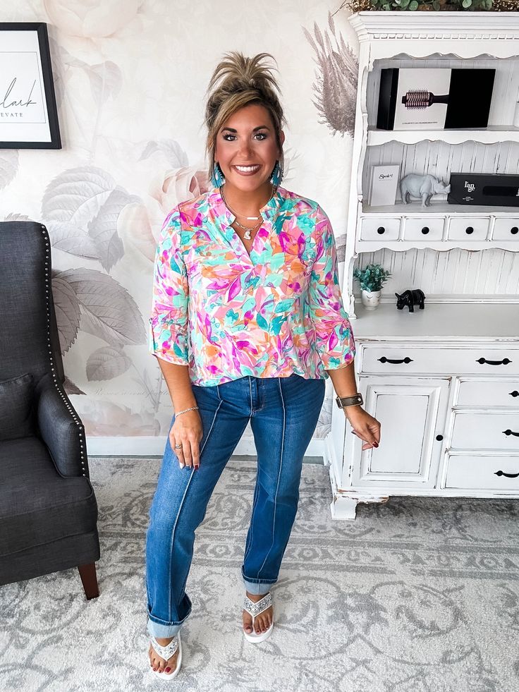 Some tops make a subtle statement. This isn’t one of them. While its notched V-neck and 3/4 sleeves keep things chic. Pair this top with your favorite distressed denim for a laid-back boho vibe or a structured blazer for a splash of color in the office. However you style it, one thing’s for sure: in this scene-stealing top, you’ll be the center of attention. After all, when you’ve got a print this unapologetic and a silhouette this flattering, the only option is to make a memorable impression. F Spring Split Neck Blouse For Brunch, Trendy 3/4 Sleeve Blouse For Brunch, Spring Tops With Frayed Hem For Casual Gatherings, Casual Spring Blouse With Frayed Hem, Trendy Spring Tops With 3/4 Sleeves, Trendy 3/4 Sleeve Tops For Spring, Spring 3/4 Sleeve Tops For Casual Gatherings, Spring Casual Gatherings Tops With 3/4 Sleeves, 3/4 Sleeve Tops For Spring Casual Gatherings