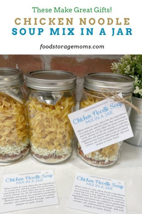 three jars filled with chicken noodle soup on top of a table next to two tags