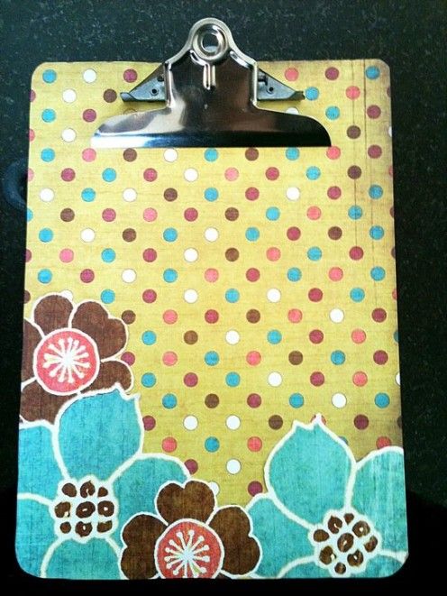 a clipboard with flowers and polka dots on it