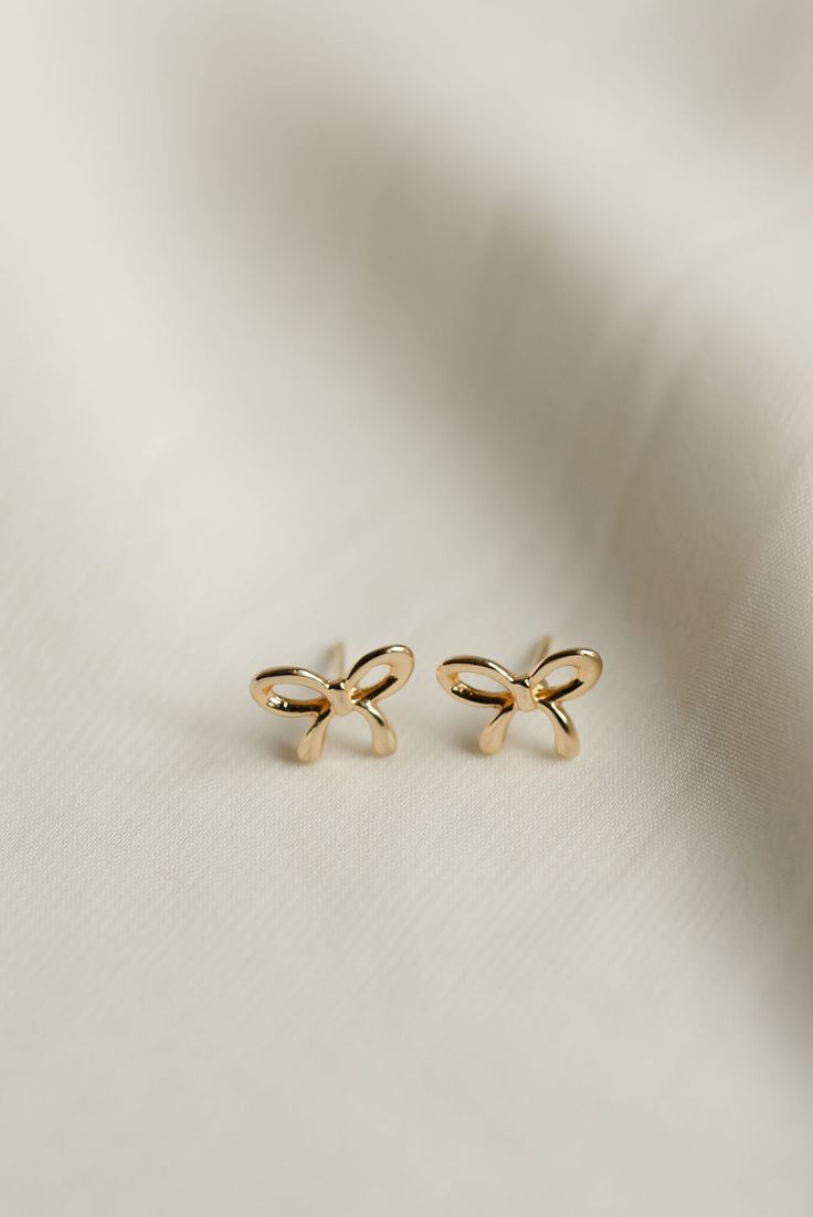 Rumor has is that 2024 is the year of BOWS! These super cute, bow stud earrings are the dainty, delicate, and prefect for all day wear. Includes two gold or silver-plated bow studs Approx. 1/2" Choose from either gold or silver Dainty Stud Earrings, Simple Studs, Everyday Wear Jewelry, All That Glitters Is Gold, Dainty Studs, Woman Business Owner, Bow Earrings, Cute Bow, Perfume Spray