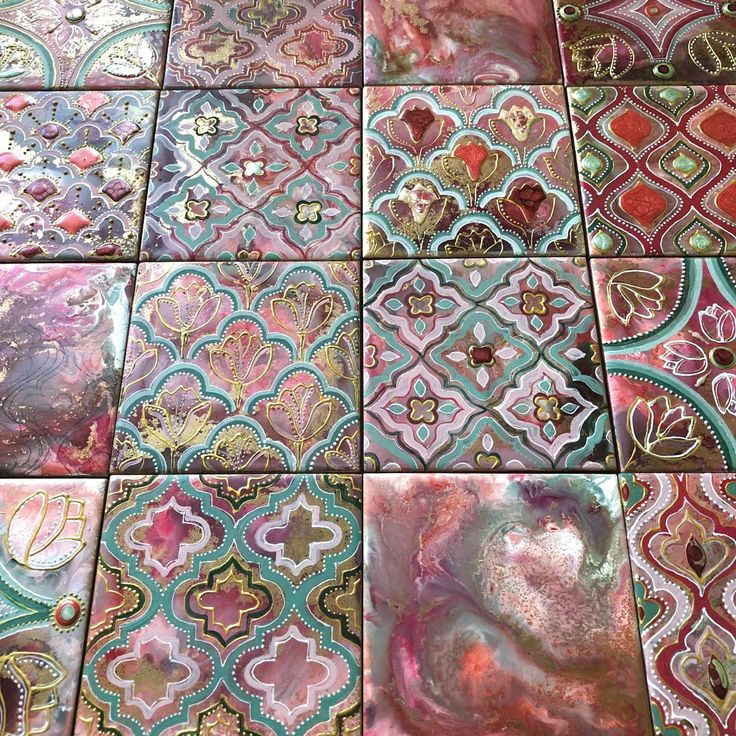 many different colored tiles with designs on them